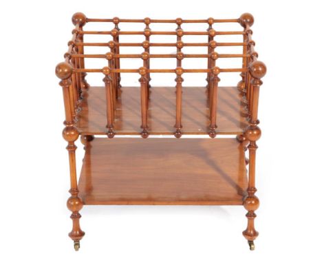 A Rare Howard &amp; Sons Walnut Four-Division Canterbury, late 19th century, with bobbin turned supports and legs joined by a