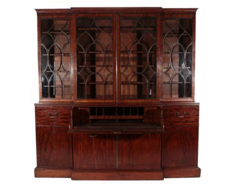 A Late George III Mahogany and Ebony Strung Breakfront Library Bookcase, early 19th century, in three sections, the cavetto c