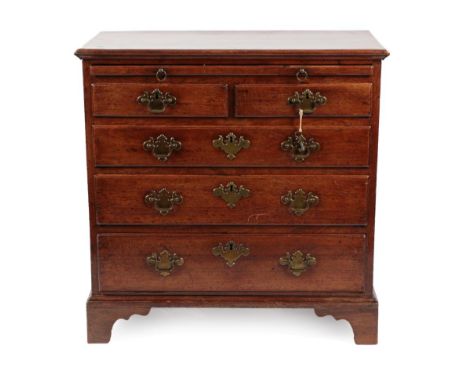A George III Mahogany Bachelor's Chest, late 18th century, with pull-out brushing slide above two short and long graduated dr