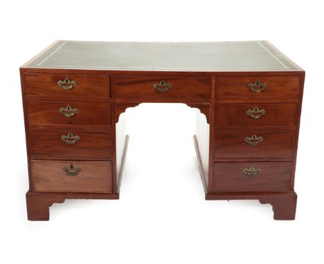  ~ A Late George III Mahogany Partners' Desk, early 19th century, the green and gilt leather writing surface above a central 