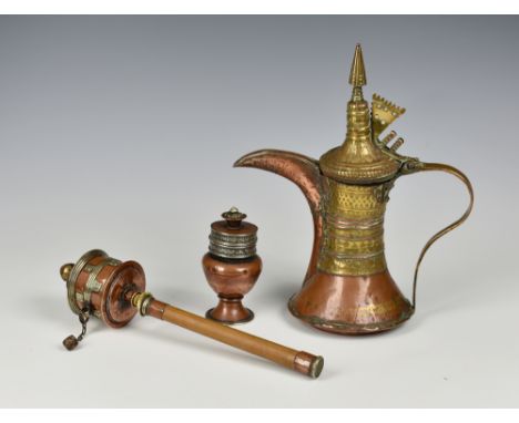 An 18th or 19th century Middle Eastern Persian copper and brass Dallah coffee pot, with flared cylindrical body, tapered spou