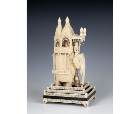 An impressively large Indian carved ivory model of an elephant howdah with Maharajah, mid-19th century, modelled with richly 