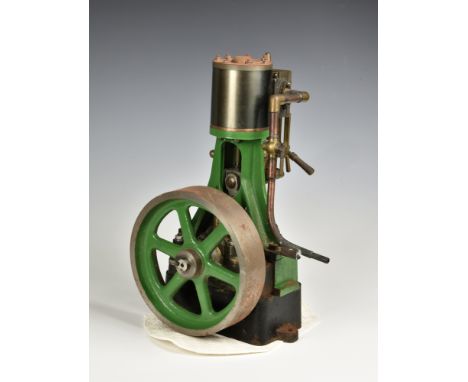 A large well engineered stationary vertical single cylinder live steam engine, single spoked flywheel (7½ inch diameter) to s