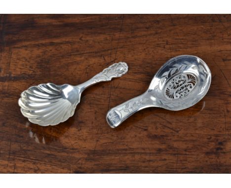 Two silver caddy spoons, the first by Samuel Pemberton, Birmingham, 1804, the George III caddy spoon with scroll-work surroun