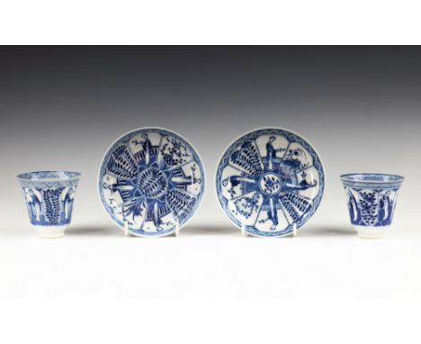 Two Chinese porcelain blue and white tea bowls and saucers, Kangxi four character marks and probably of the period (1662-1722
