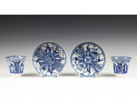 Two Chinese porcelain blue and white tea bowls and saucers, Kangxi four character marks and probably of the period (1662-1722