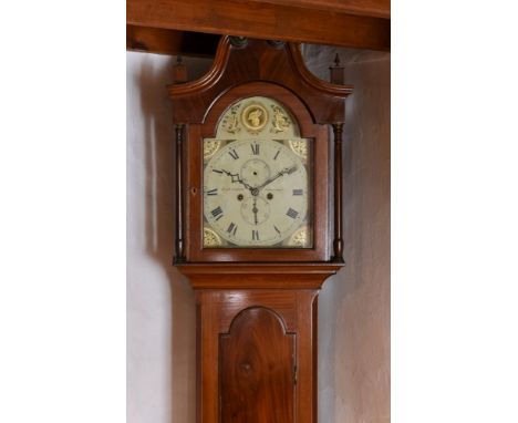 An early 19th century Channel Islands mahogany longcase clock, by Thomas Naftel, the case with swan's neck pediment with thre