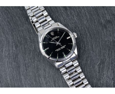 A Rolex stainless steel Oyster Perpetual gentleman's automatic wrist watch, 1970s, black 27mm. dial signed 'ROLEX OYSTER PERP