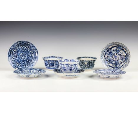 A Chinese porcelain blue and white tea bowl and saucer, Kangxi four character mark and of the period (1662-1722), the bowl de