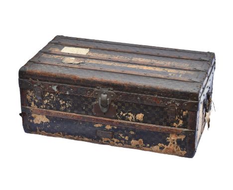 A late 19th century Louis Vuitton travelling trunk, covered in the Damier pattern canvas with two painted yellow stripes, emb