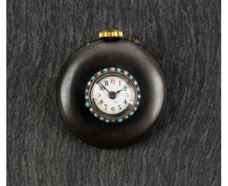 An early 20th century gun metal buttonhole watch, the white enamel face with Arabic numbers, spaced with gold coloured enamel
