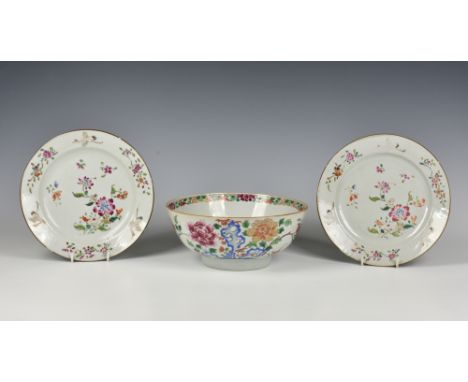 A Chinese porcelain famille rose punch bowl, late 18th century, enamelled with peonies issuing from kakiemon blue rockwork, t