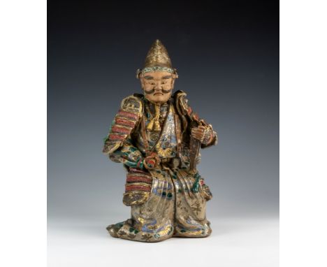 An antique Chinese glazed stoneware figure of a Samurai warrior, possibly Shiwan, 19th century, the seated figure in full arm