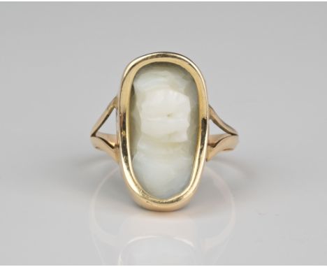 An antique 9ct gold and white stone ring with hidden face - possibly jade,&nbsp;late 19th / early 20th century, the natural w