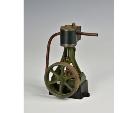 A well engineered stationary vertical single cylinder live steam engine, single spoked flywheel to side, painted khaki green,