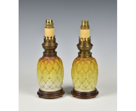 A pair of Victorian novelty satin glass oil lamps, probably by Thomas Webb, in the form of pineapples, graduated from amber t