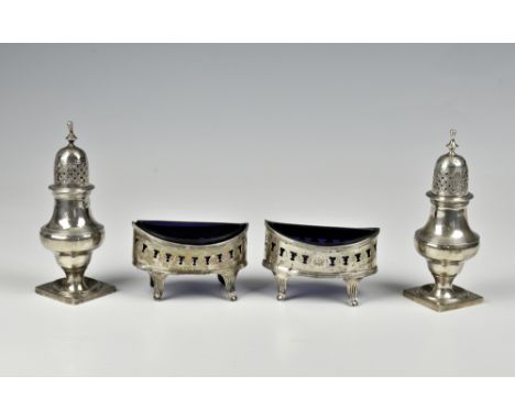 A matched pair of silver navette open salts with blue liners, one marked for London, 1802, the other Birmingham, the pierced 