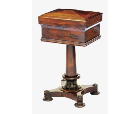 A William IV rosewood teapoy, the slightly peaked caddy top enclosing the original fitted interior with four lidded caddies a