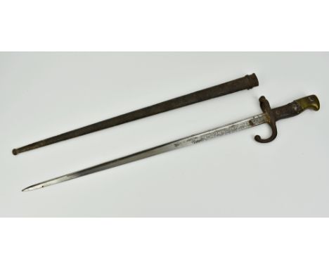 A French Gras bayonet and scabbard, wooden grip, the back of the blade engraved "Mre D'Armes de st Etienne juin 1879", relic 