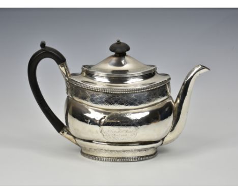 A George III silver teapot, London, 1803, makers mark overstamped &amp; indistinct, of bellied oval form with chased bright c