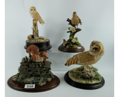 A collection of resin figures to include owls, fox jumping rock and Thrush standing (4)