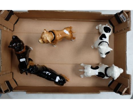 A collection of unmarked ceramic figures of dogs (5)