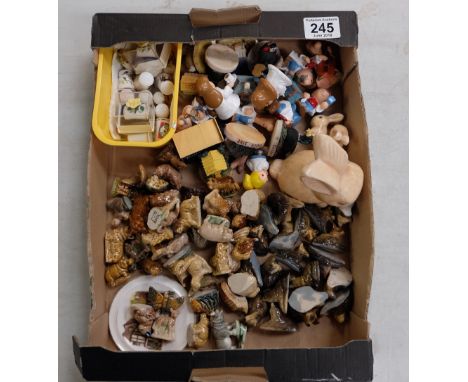 A mixed collection of items to include Wade Whimsies, ceramic rabbits, etc