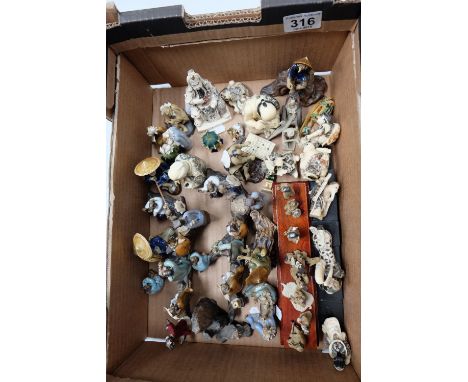 A collection of 20th Century tin glaze oriental figures together with similar resin pieces 