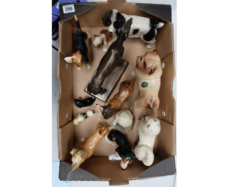 A mixed collection of ceramic and resin dogs, including Melbaware items, Cooper craft pieces etc (9)