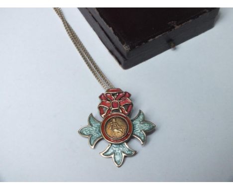 AN SILVER &amp; ENAMEL O.B.E BADGE ON A SILVER CHAIN 