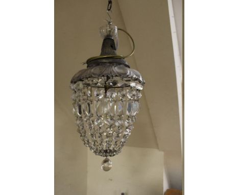 A GLASS CRYSTAL LUSTRE CEILING LIGHT WITH MOUNTING ROSE. having various cut glass droppers forming a closed basket, with lowe
