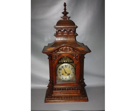 A LARGE AND IMPRESSIVE LATE 19/EARLY 20TH CENTURY WALNUT MANTEL CLOCK BY GUSTAV BECKER, the well carved case with scrolling f