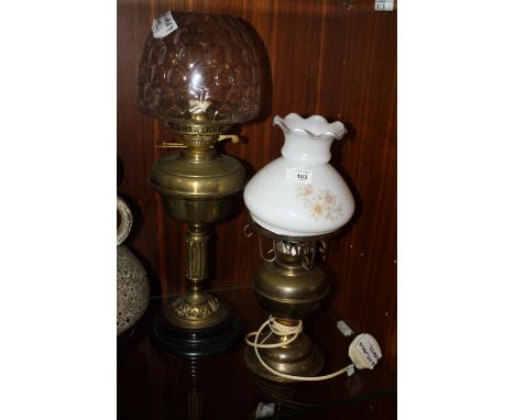 A VINTAGE OIL LAMP WITH GLASS SHADE, TOGETHER WITH A CONVERTED OIL LAMP (2) 
