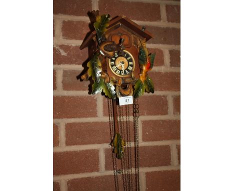 A VINTAGE WOODEN CUCKOO CLOCK &amp; WEIGHTS 