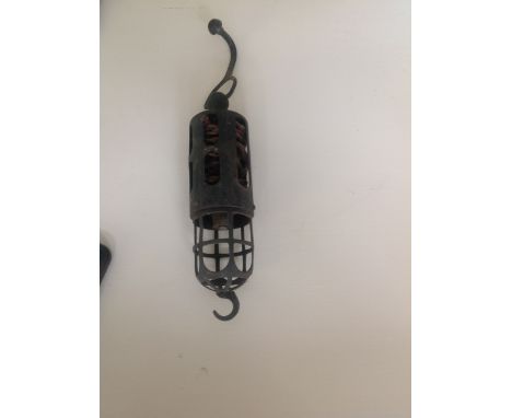 A vintage bird cage inspection lamp