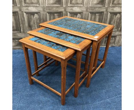 MAHOGANY NEST OF THREE TILE TOP TABLES, 48cm high, 57cm wide