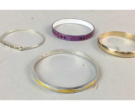 SILVER ENAMELLED BANGLE AND THREE OTHER BANGLES, the silver enamel example with decoration in yellow