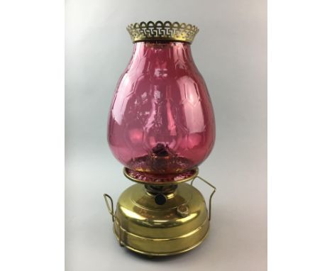 LARGE OIL LAMP, with cranberry glass shade, 44cm high