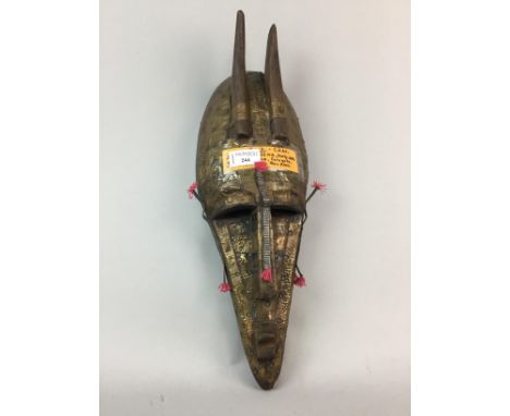 20TH CENTURY AFRICAN MASK, along with an African sword, dagger and three fly whisks