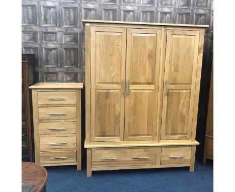 OAK THREE DOOR WARDROBE, 145cm wide, 185cm high, along with an oak chest of drawers comprising five drawers (2)