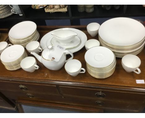 ROYAL WORCESTER DINNER AND TEA SERVICE, in white with gold banding, approximately 99 pieces