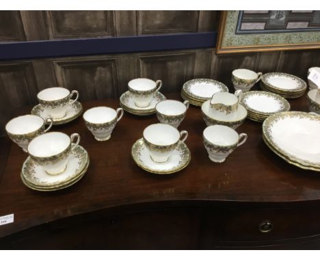 HAMMERSLEY TEA SERVICE, in green and gilt, including two cake plates