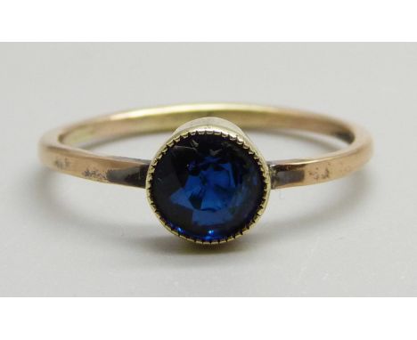 A vintage blue stone solitaire ring, marked 15c, 1.9g, M 