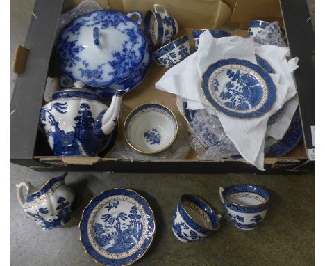 A Booths Real Old Willow pattern blue and white china tea set and a flow blue tureen 