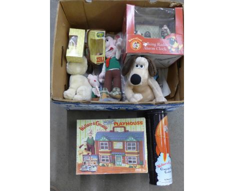 A box of Wallace and Gromit merchandise including radio alarm clock and playhouse**PLEASE NOTE THIS LOT IS NOT ELIGIBLE FOR P