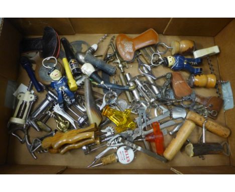 Approximately fifty vintage bottle openers and corkscrews 