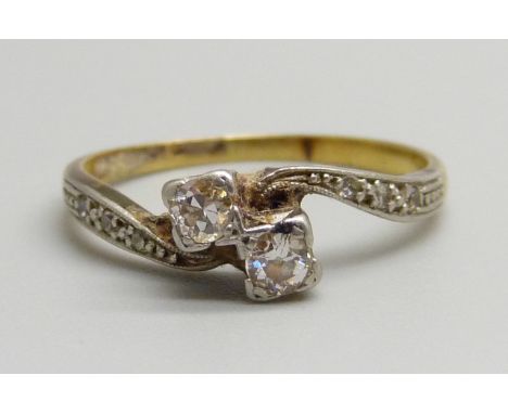 An 18ct gold and diamond set ring, 2.2g, M 