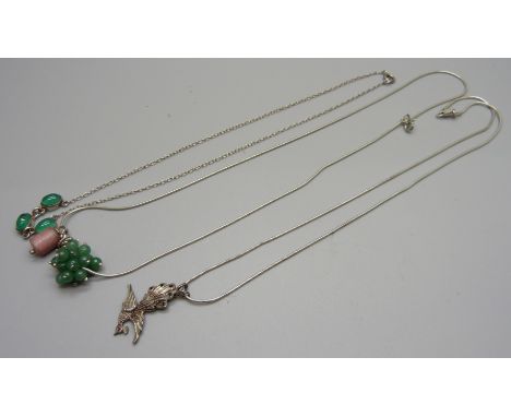 A silver, ruby and sapphire set bird pendant and chain and two silver necklaces 