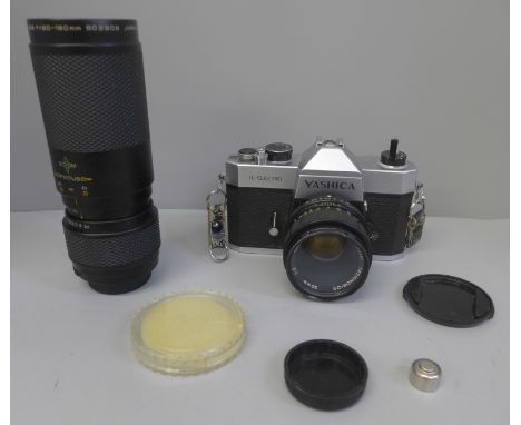 A Yashica TL-Electro camera with 50mm lens and a spare 90-190mm lens 
