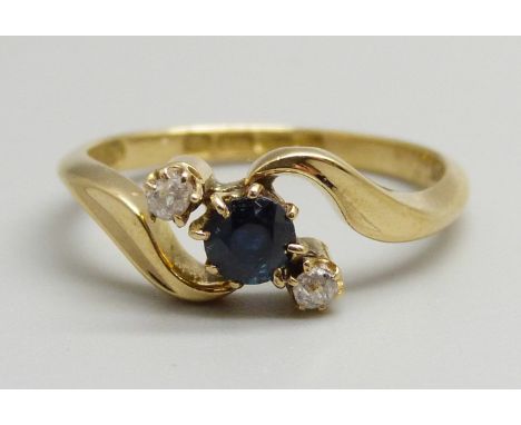 An 18ct gold, sapphire and diamond three stone crossover ring, 3.1g, O 